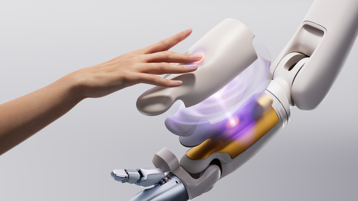 A human hand reaching toward a tactile robotic hand
